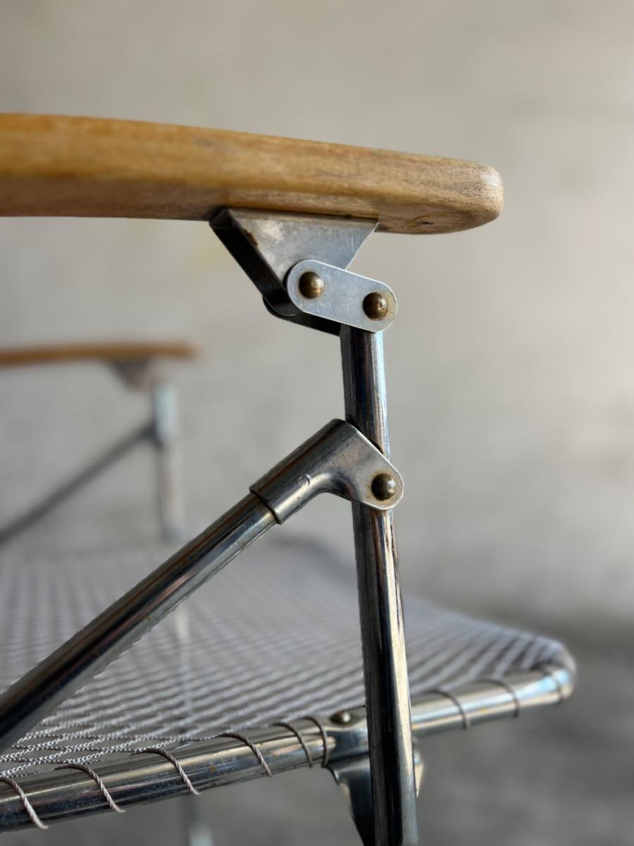 Set of two vintage folding chairs with wire frame in aluminum