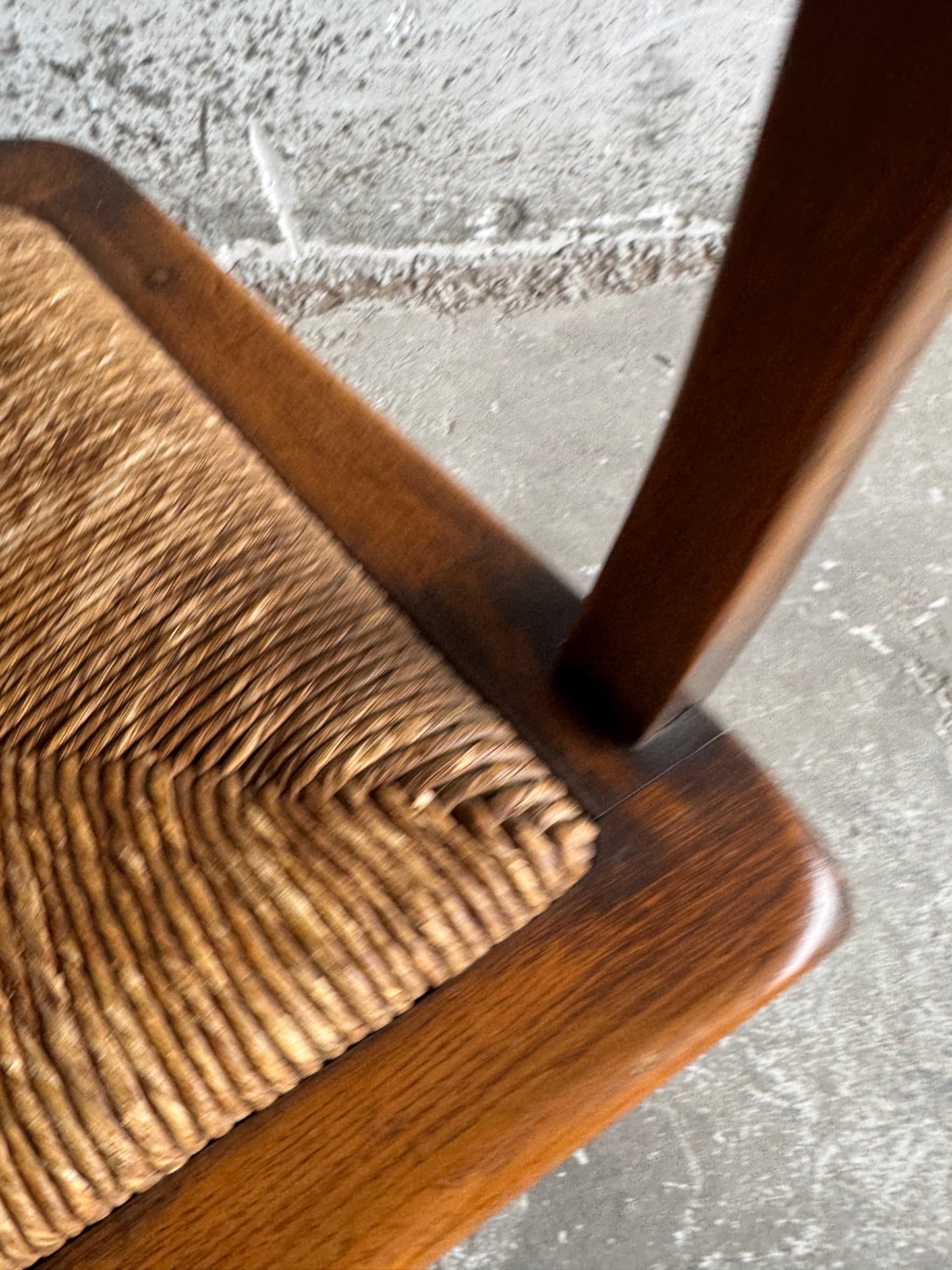Brutalist armchair with rattan seat and leather back
