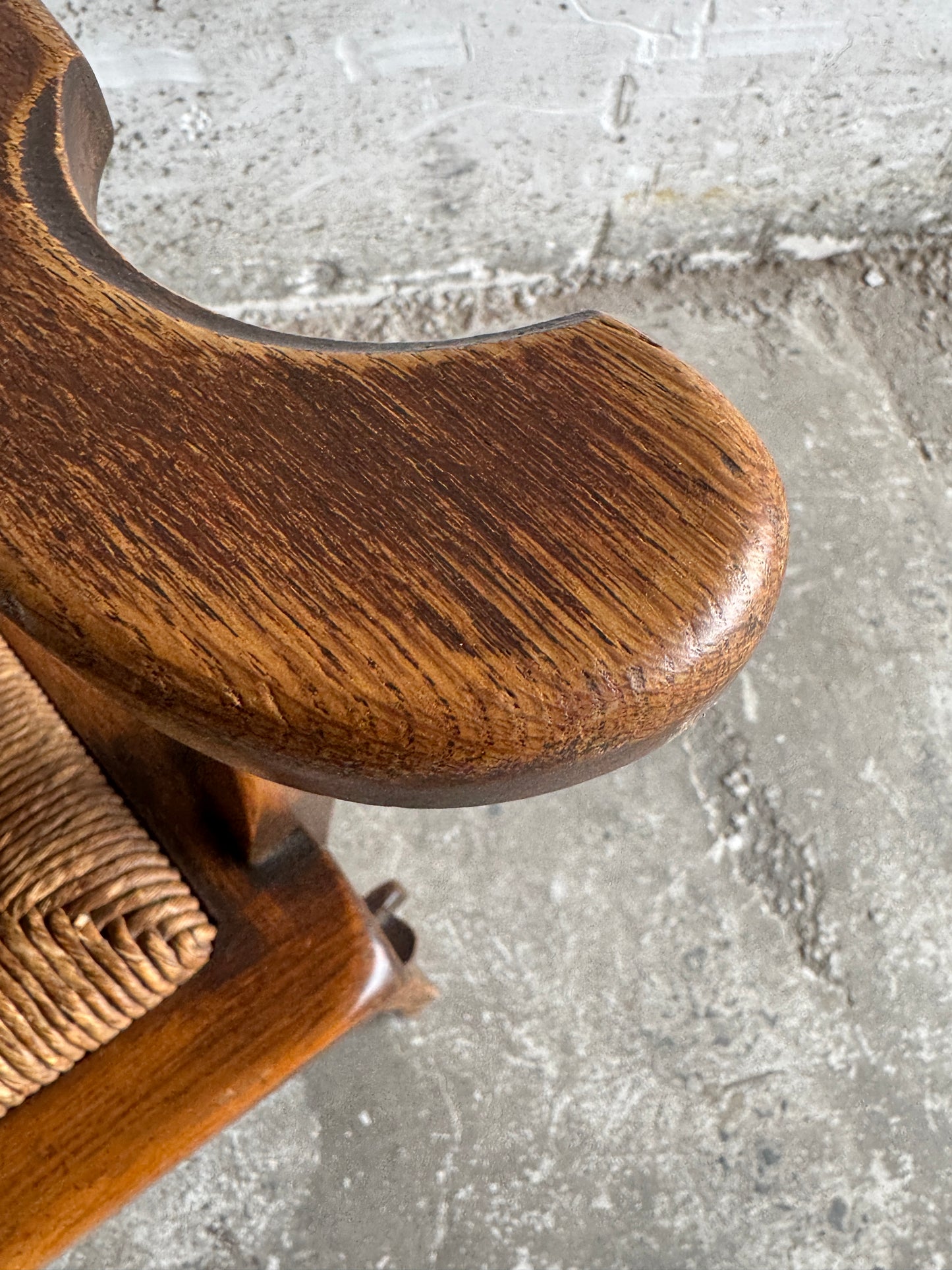 Brutalist armchair with rattan seat and leather back