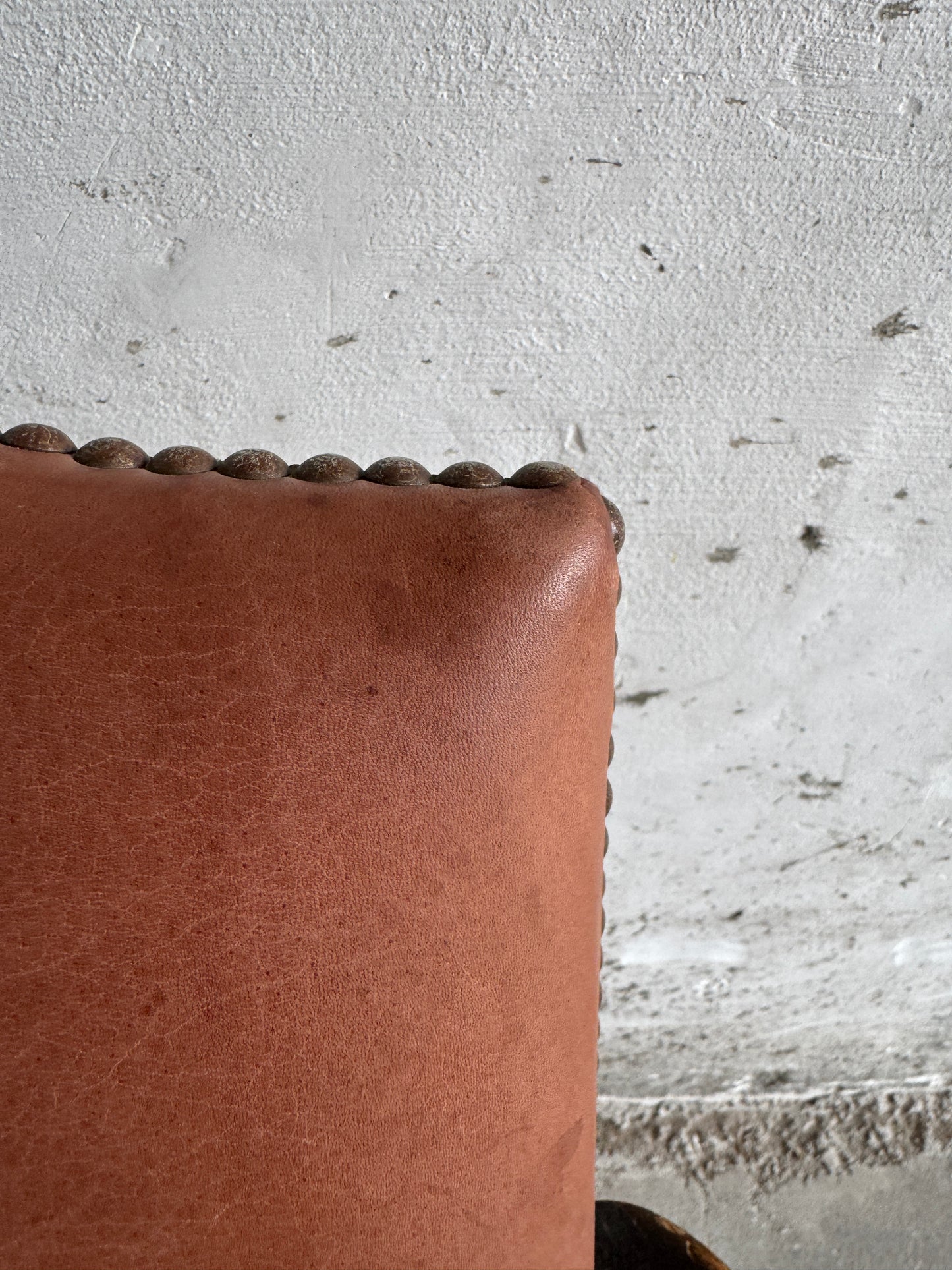 Brutalist armchair with rattan seat and leather back