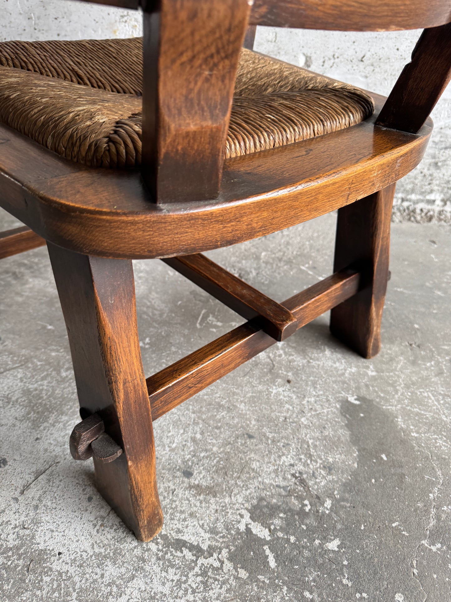 Brutalist armchair with rattan seat and leather back