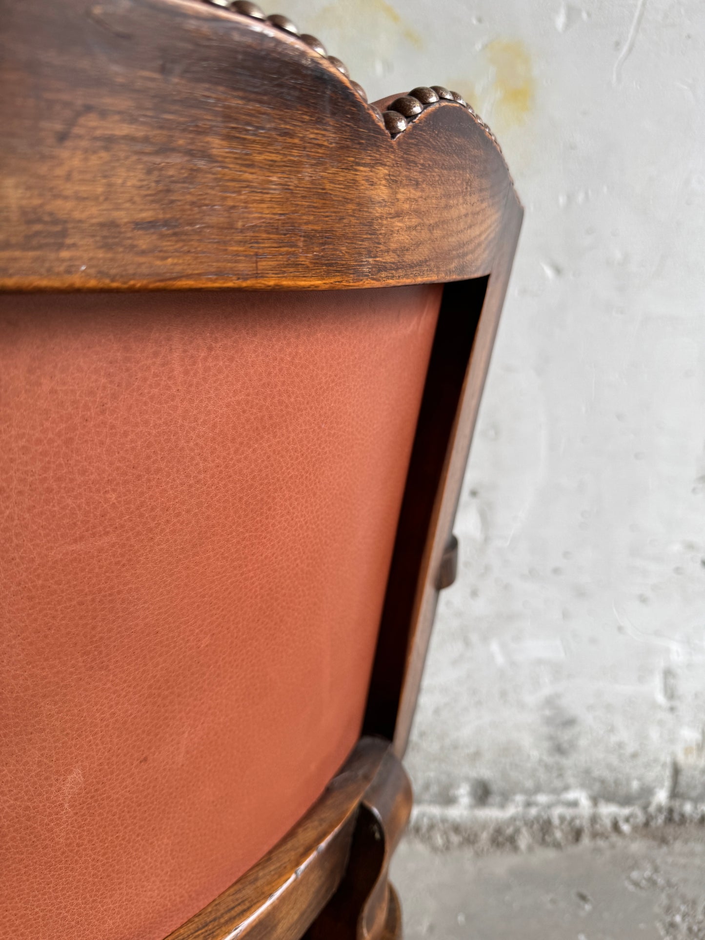 Brutalist armchair with rattan seat and leather back
