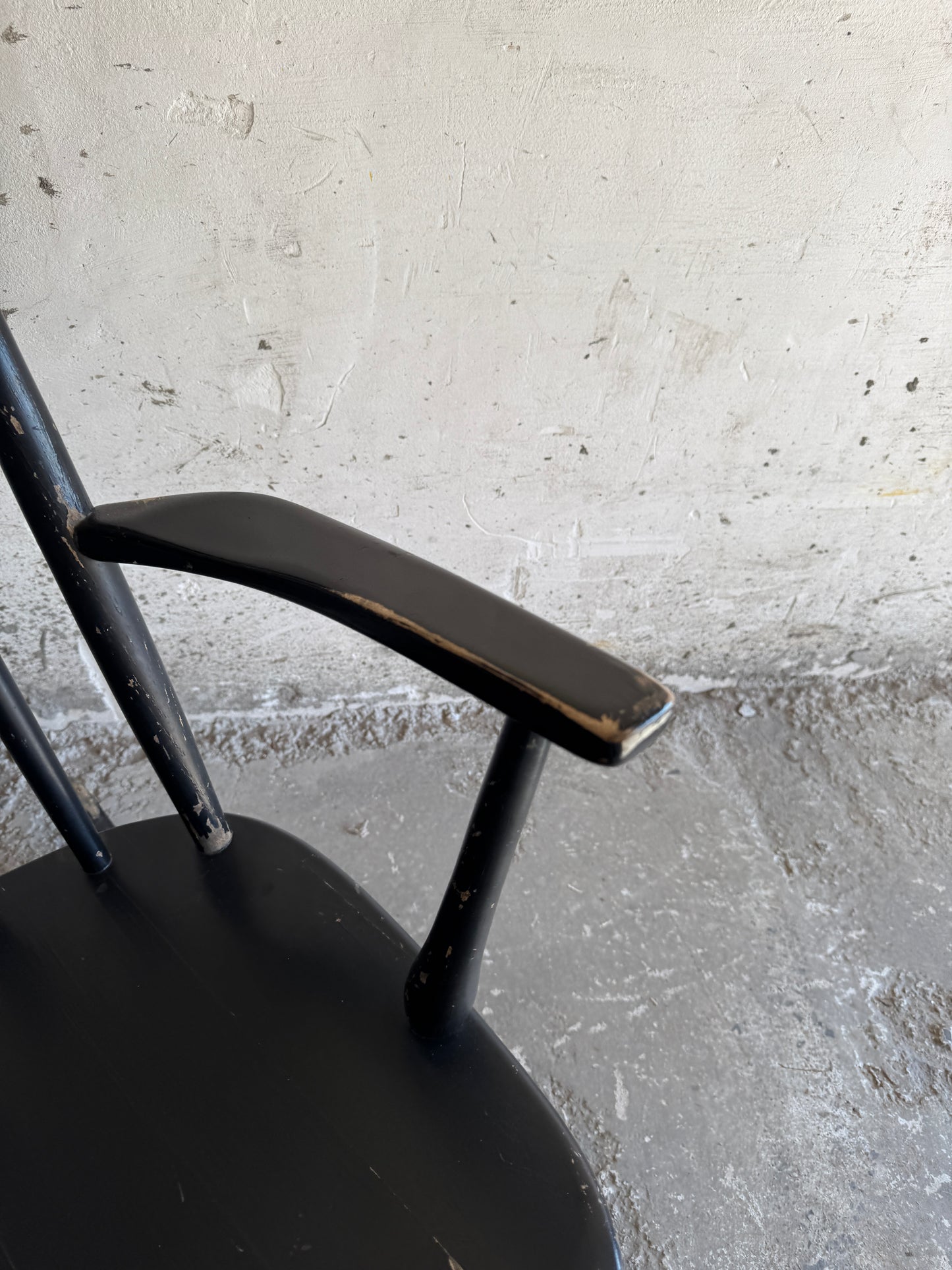 Black Scandinavian rocking chair in Windsor style