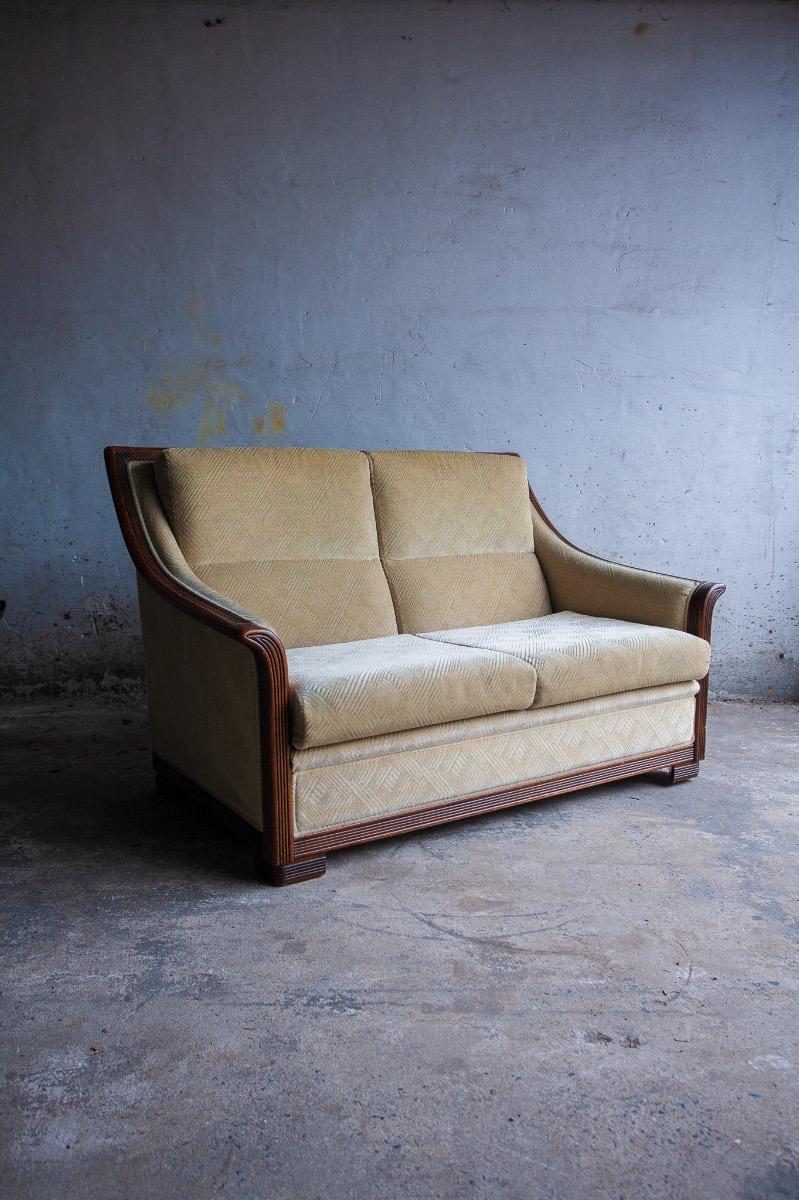 Art Deco two-seater sofa with ornate wooden details