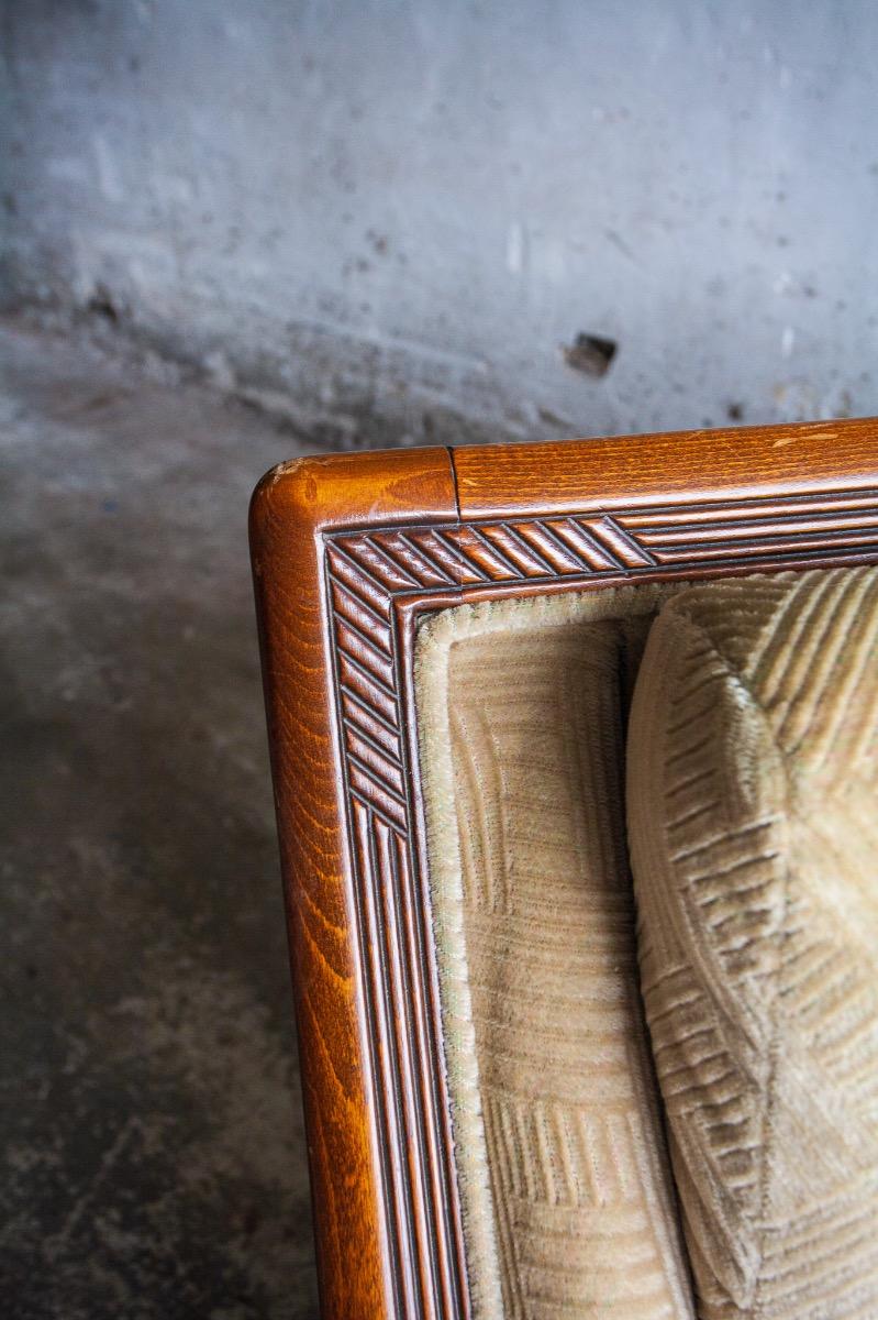 Art Deco two-seater sofa with ornate wooden details
