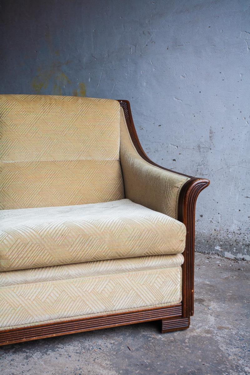 Art Deco two-seater sofa with ornate wooden details