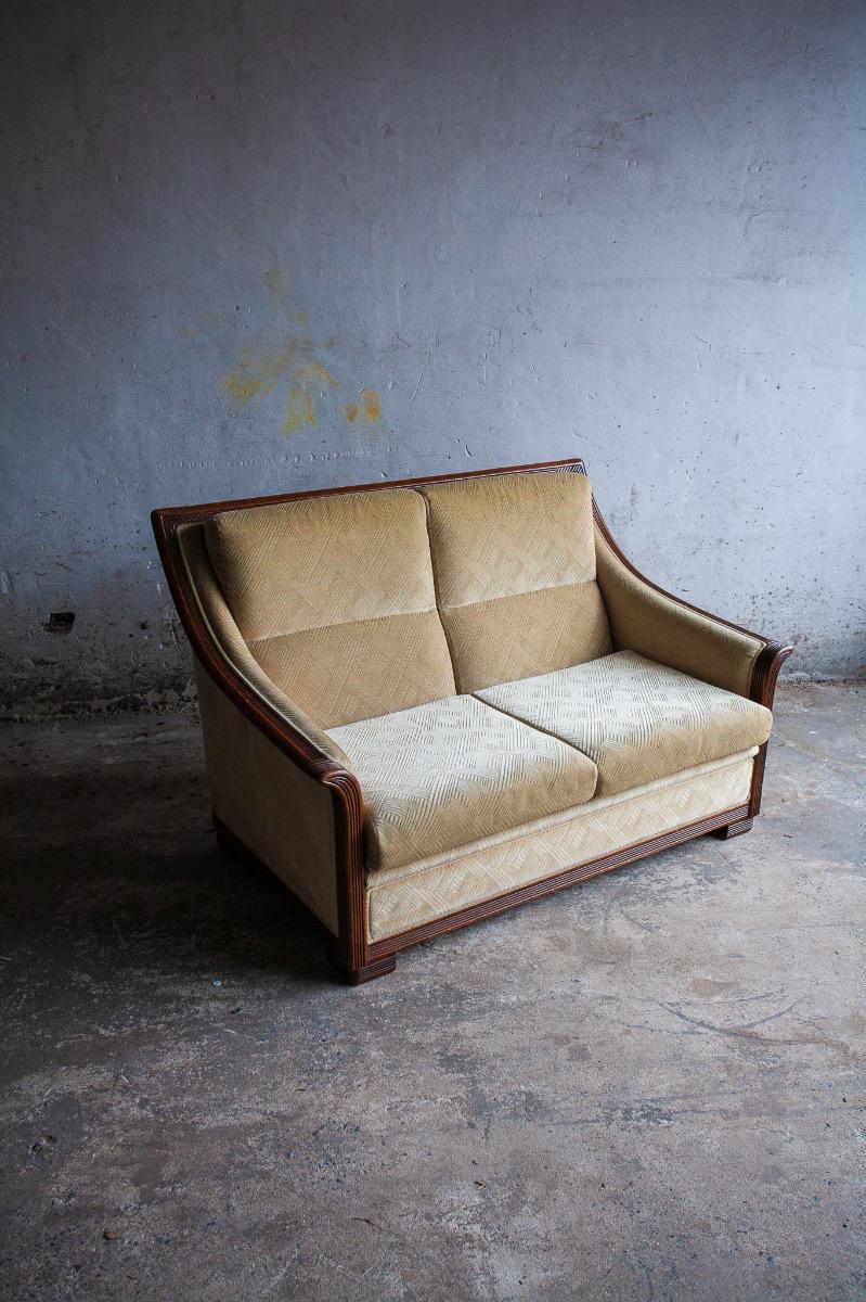Art Deco two-seater sofa with ornate wooden details