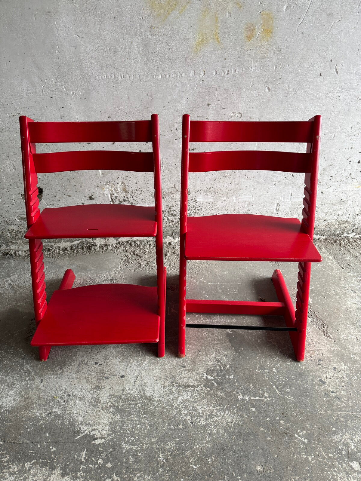 Set of 2 red children's chairs in adjustable school style (1990s)