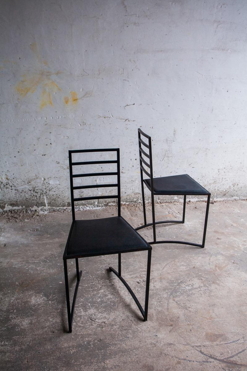 Set van 4 minimalistische eetkamerstoelen in zwart staal