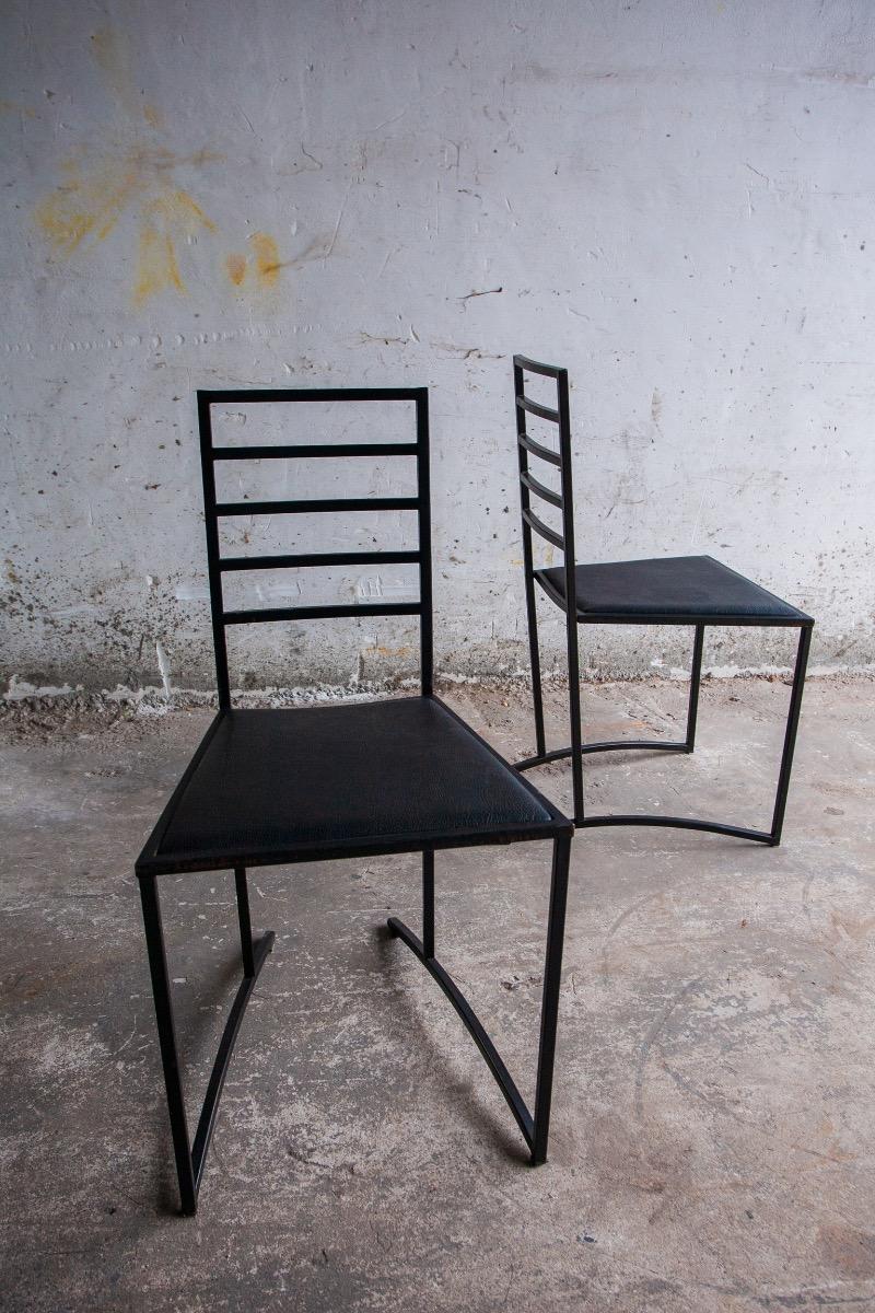 Set van 4 minimalistische eetkamerstoelen in zwart staal