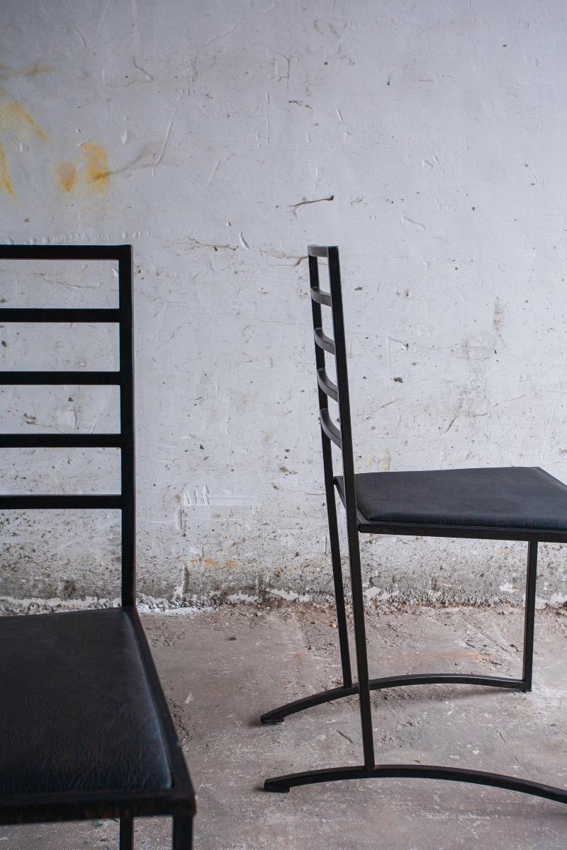 Set van 4 minimalistische eetkamerstoelen in zwart staal