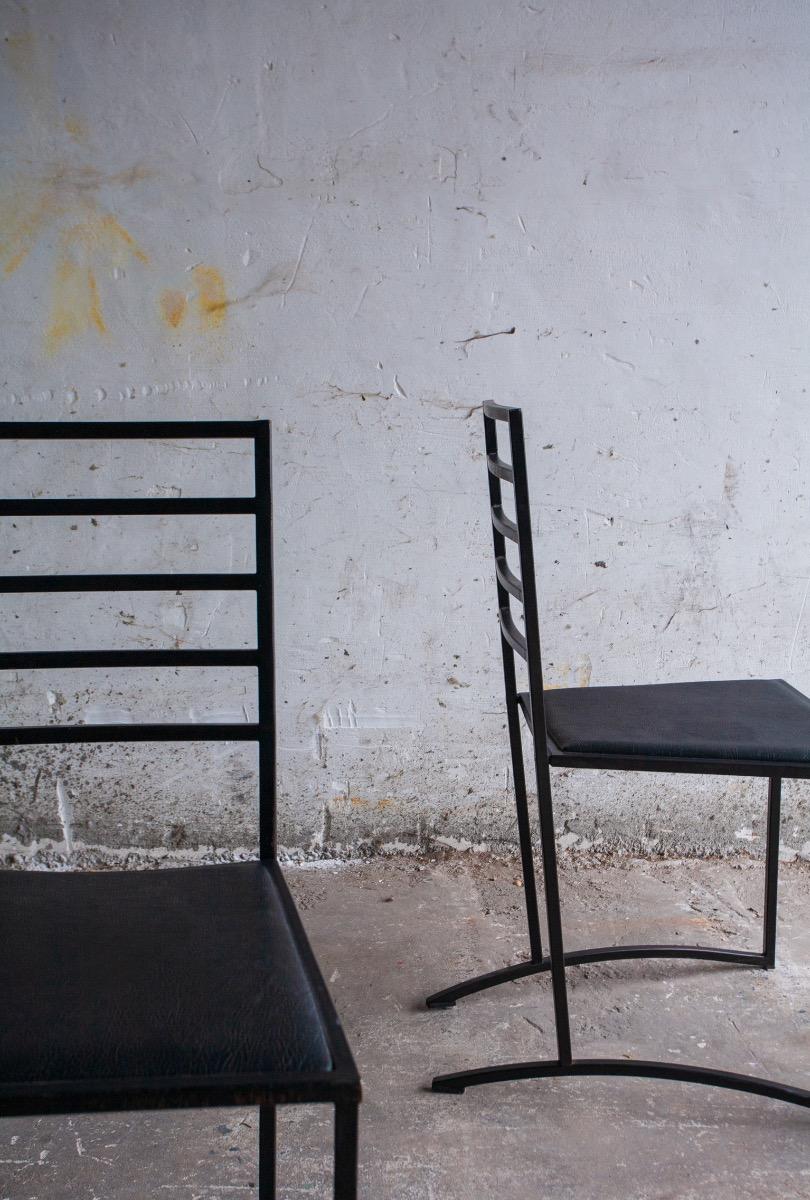 Set van 4 minimalistische eetkamerstoelen in zwart staal