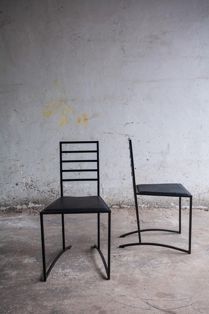 Set van 4 minimalistische eetkamerstoelen in zwart staal