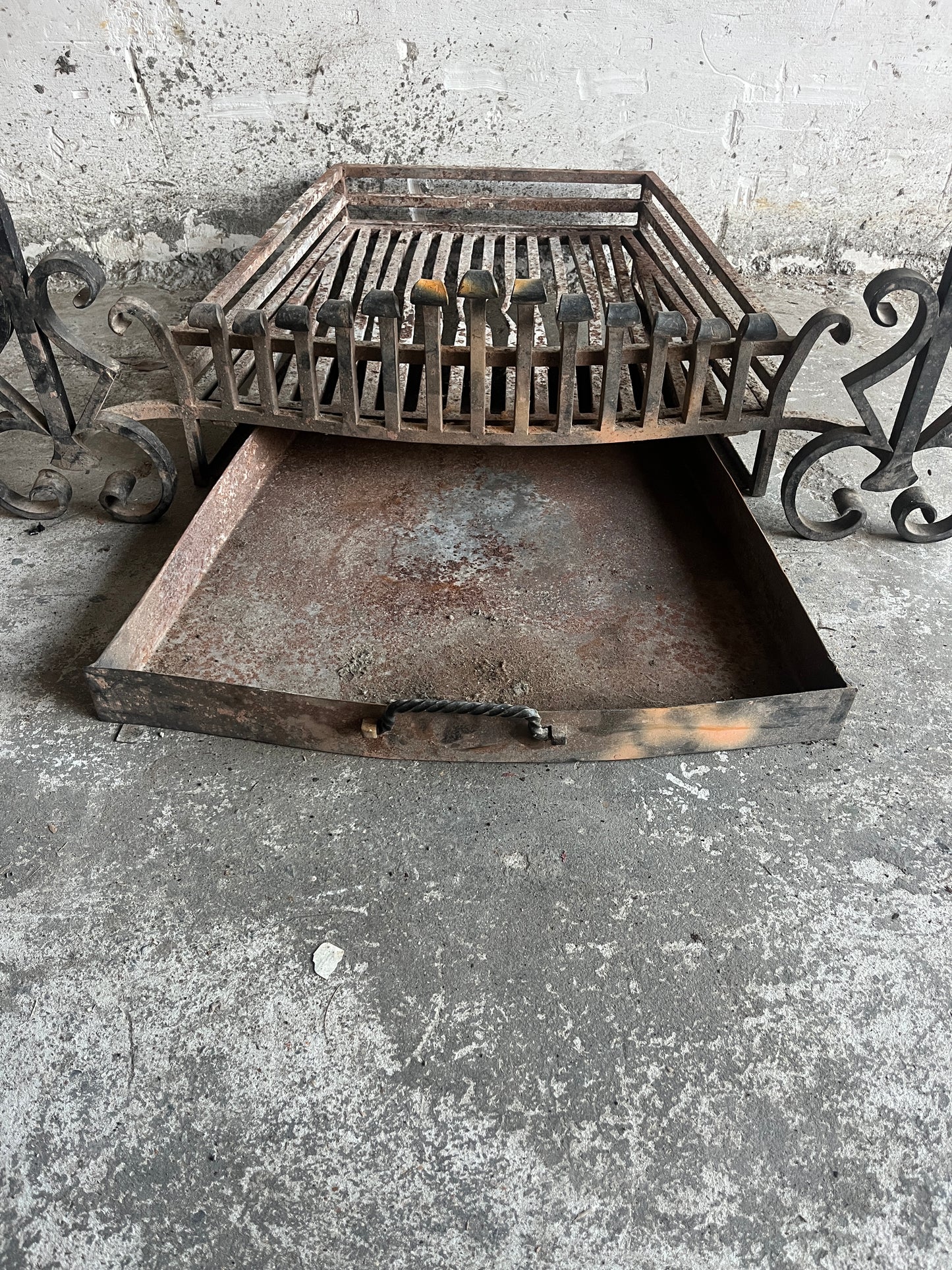Vintage wrought iron fireplace grate with andirons
