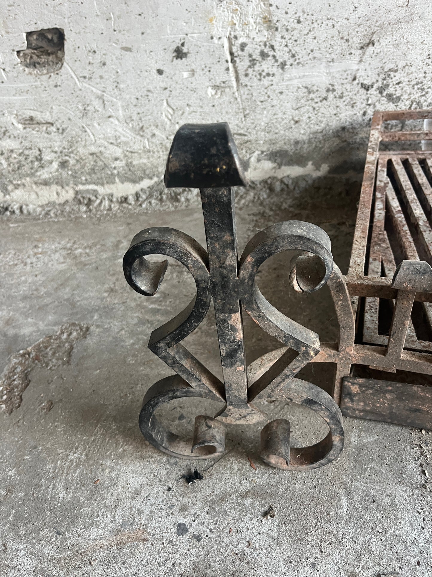 Vintage wrought iron fireplace grate with andirons