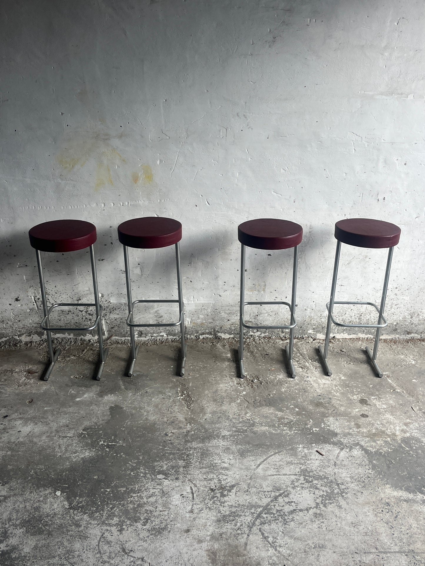 Set of 4 Industrial Bar Stools – Burgundy Seats (1980s)