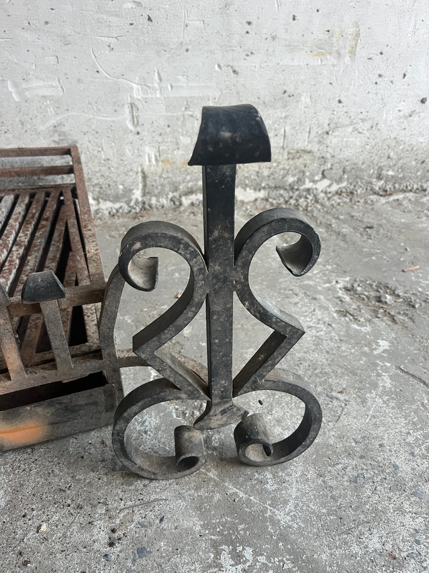 Vintage wrought iron fireplace grate with andirons