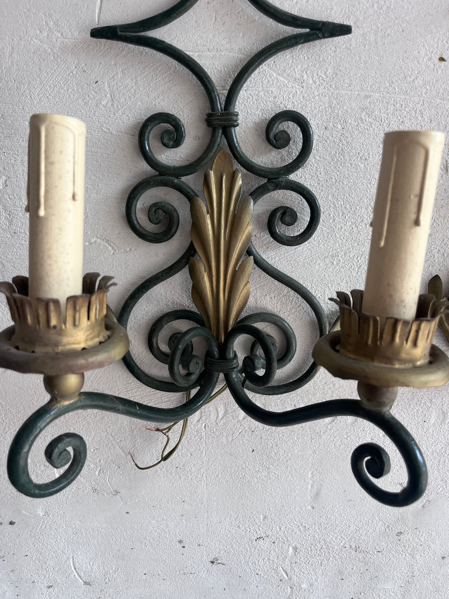 Pair of Wrought Iron Wall Sconces with Gilt Leaf Motifs
