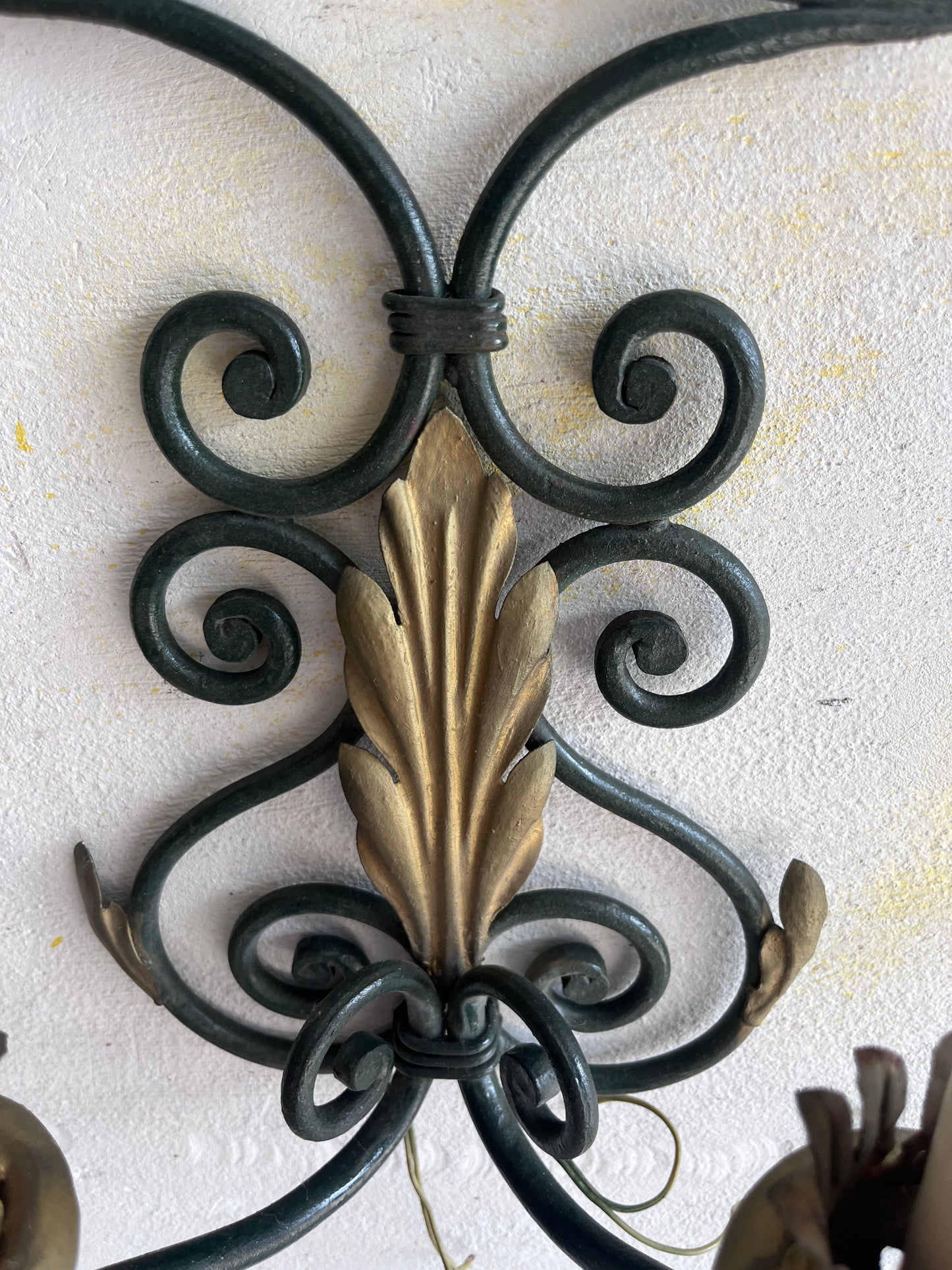 Pair of Wrought Iron Wall Sconces with Gilt Leaf Motifs