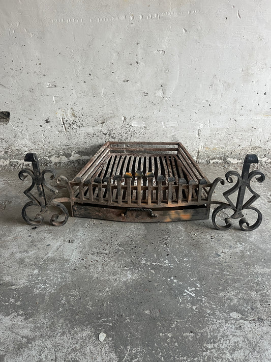 Vintage wrought iron fireplace grate with andirons