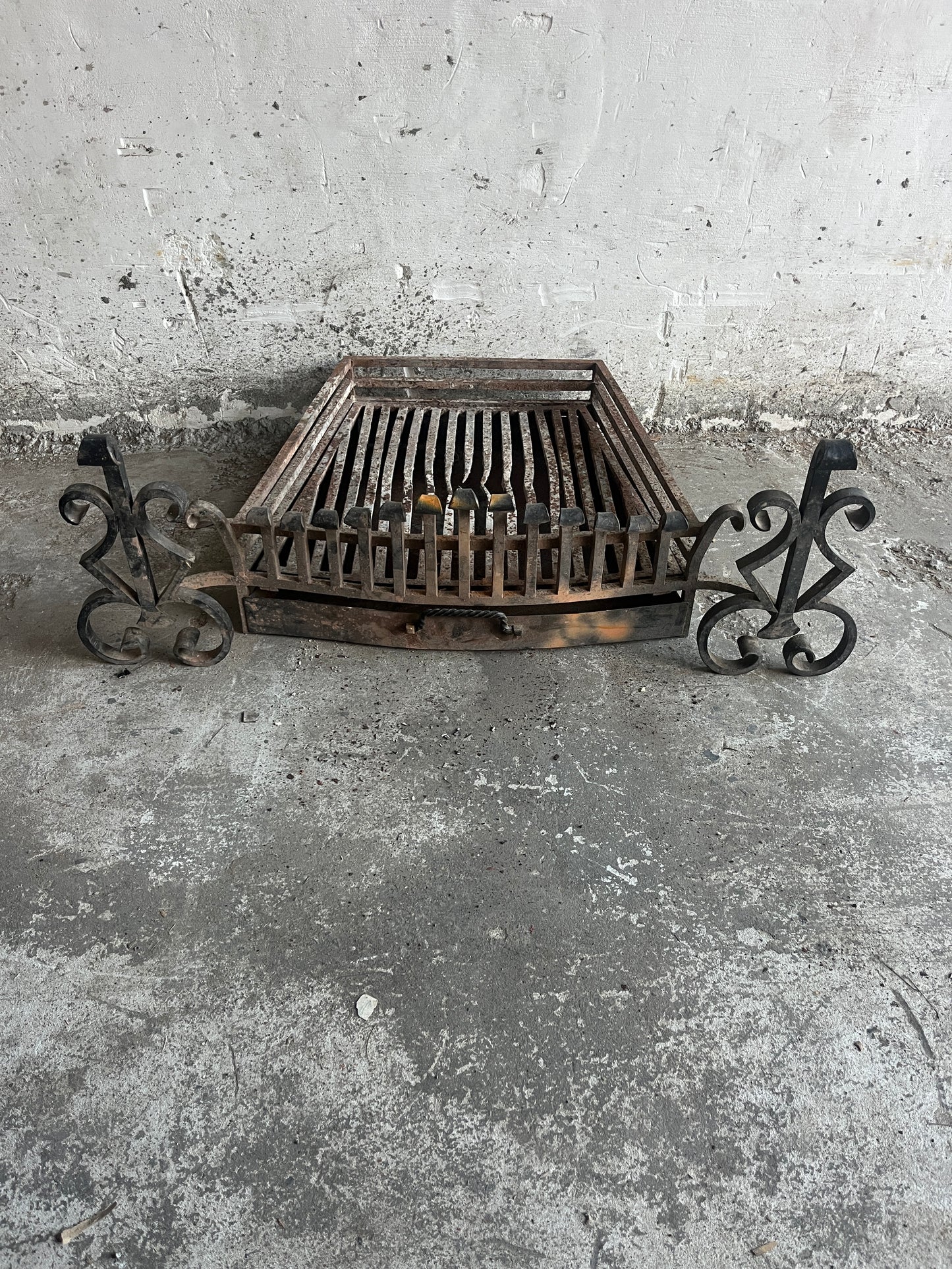 Vintage wrought iron fireplace grate with andirons
