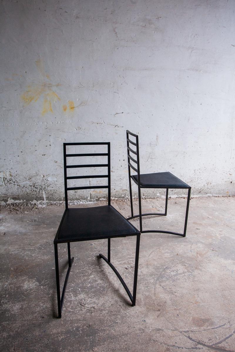 Set van 4 minimalistische eetkamerstoelen in zwart staal