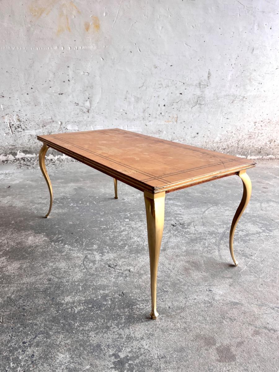 Vintage salontafel met vergulde poten en geometrisch ingelegd blad