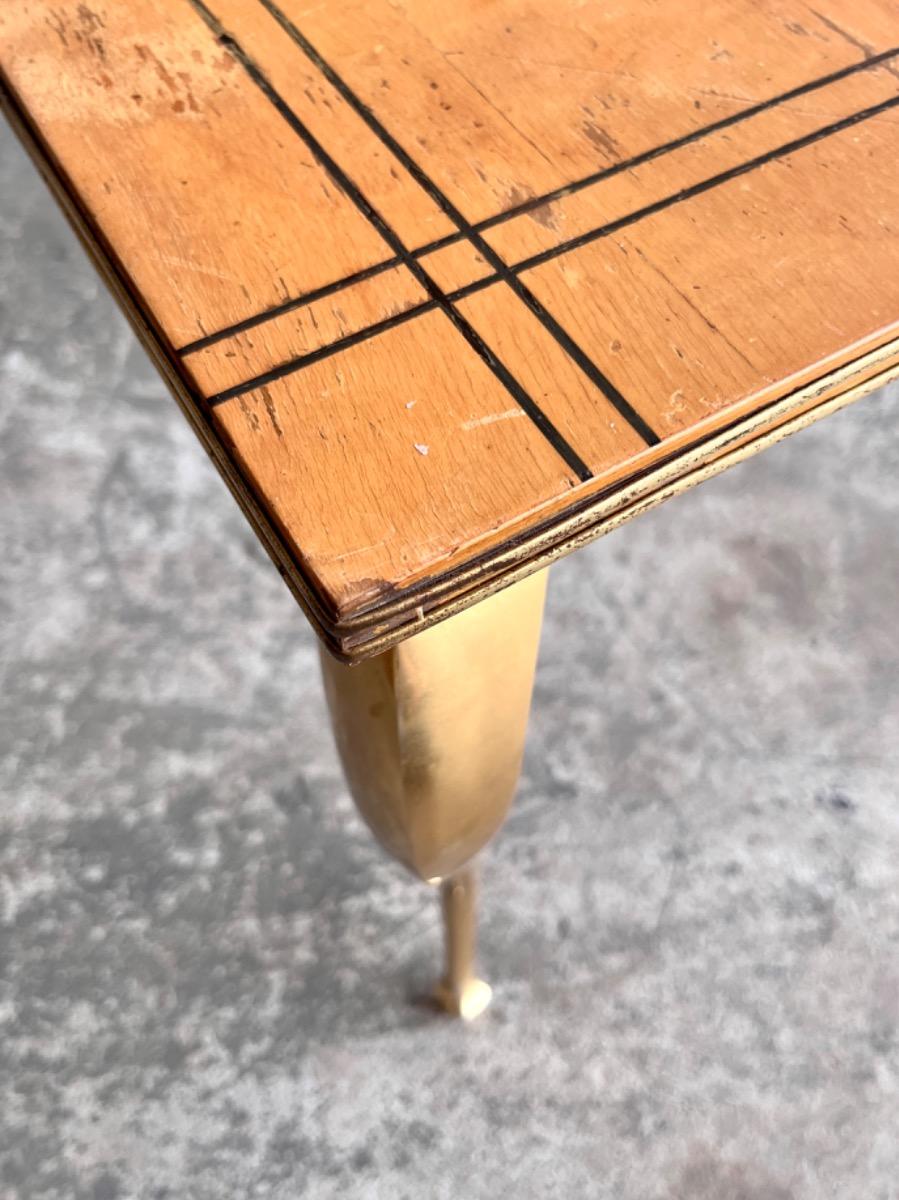 Vintage salontafel met vergulde poten en geometrisch ingelegd blad