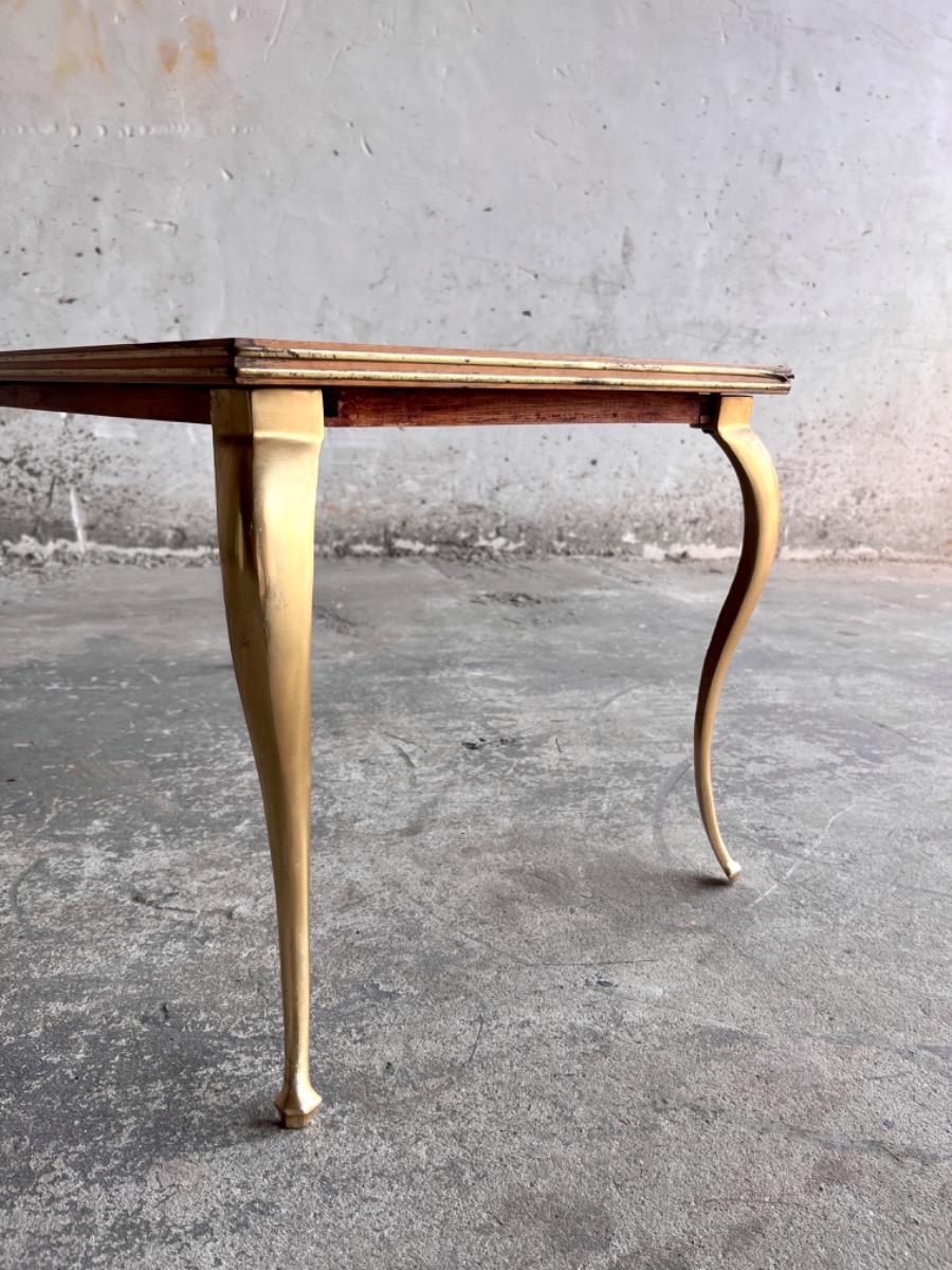 Vintage salontafel met vergulde poten en geometrisch ingelegd blad