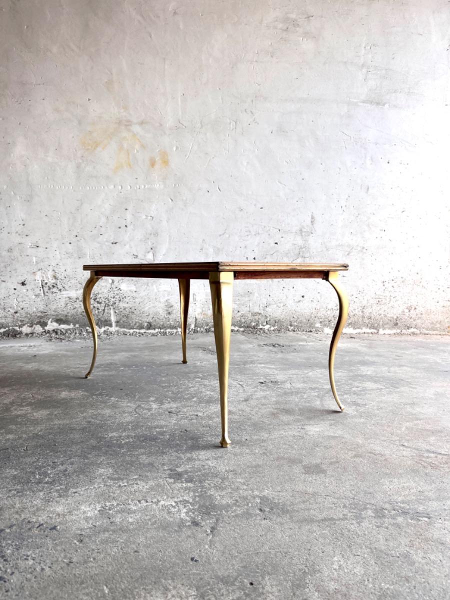 Vintage salontafel met vergulde poten en geometrisch ingelegd blad
