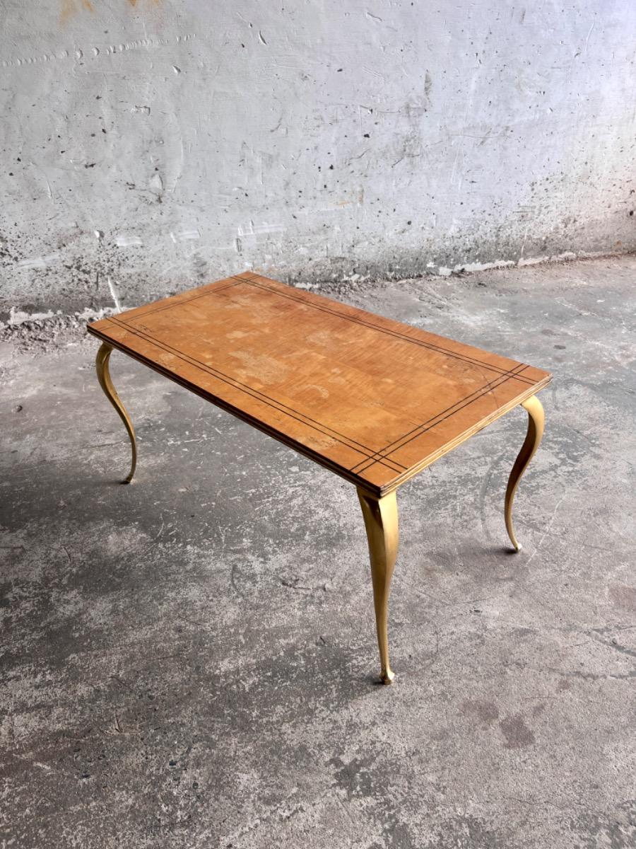 Vintage salontafel met vergulde poten en geometrisch ingelegd blad