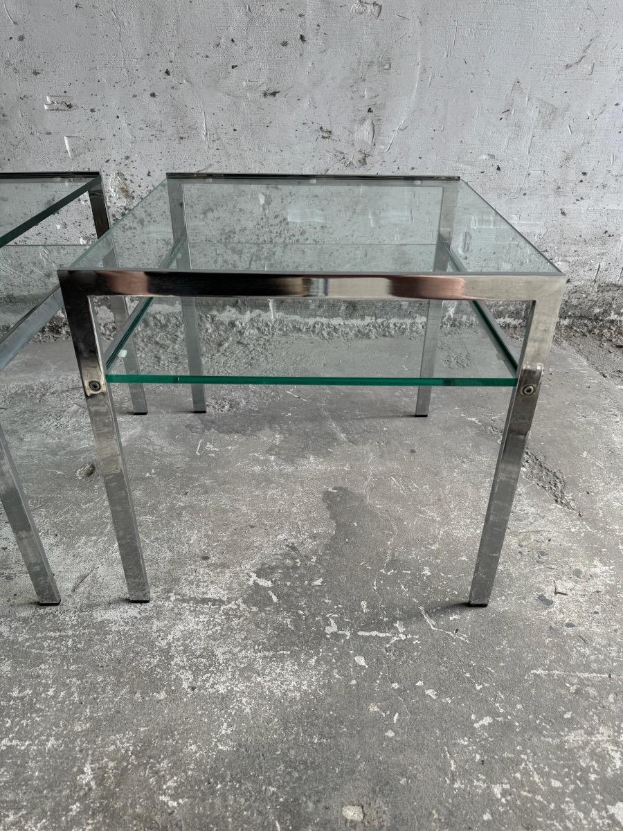 pair of coffee tables in chrome steel and glass - 1970s