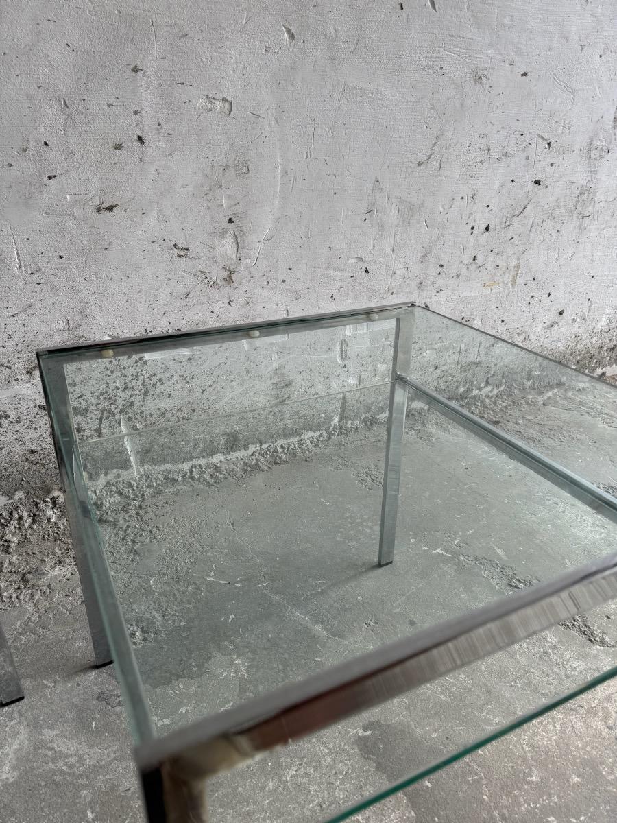 pair of coffee tables in chrome steel and glass - 1970s