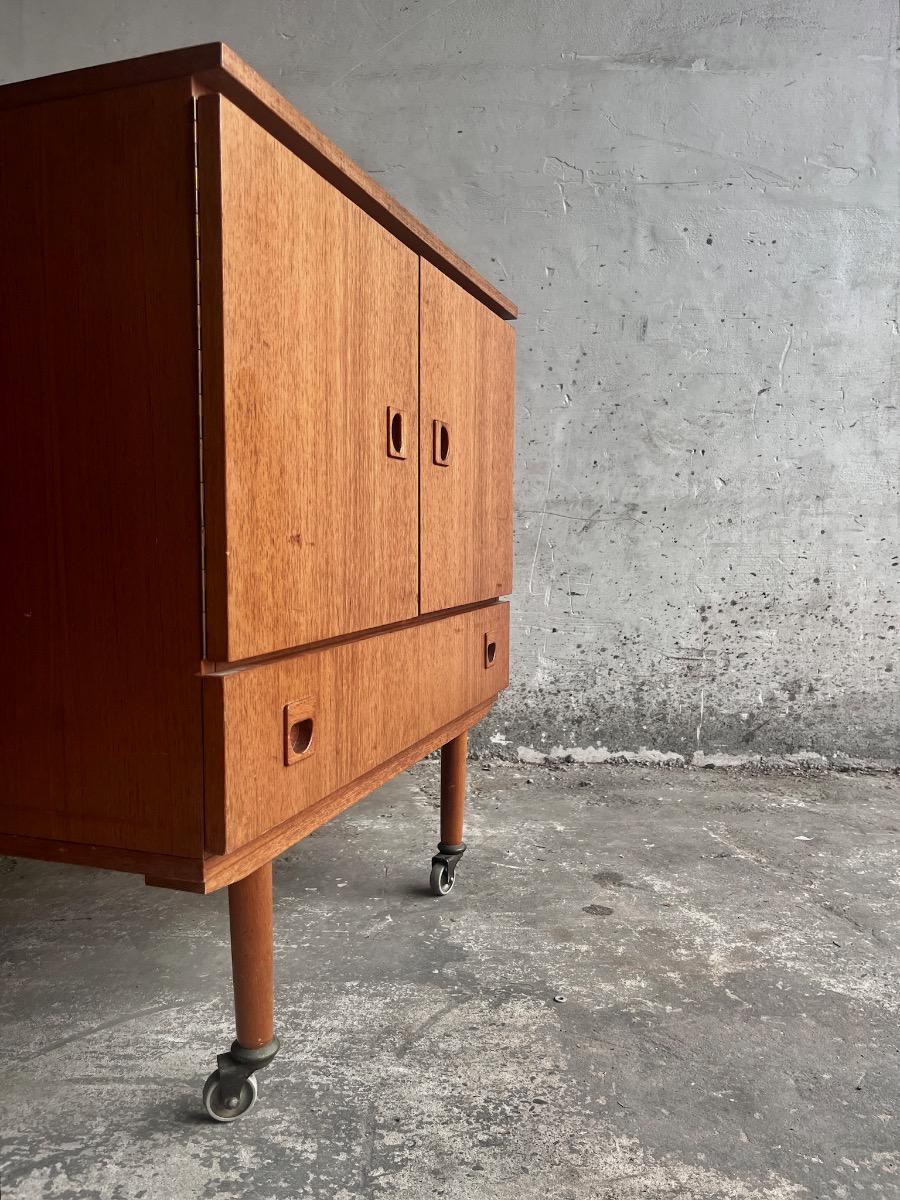 Vintage teakwood dressoir on wheels designed by Berner Huwel