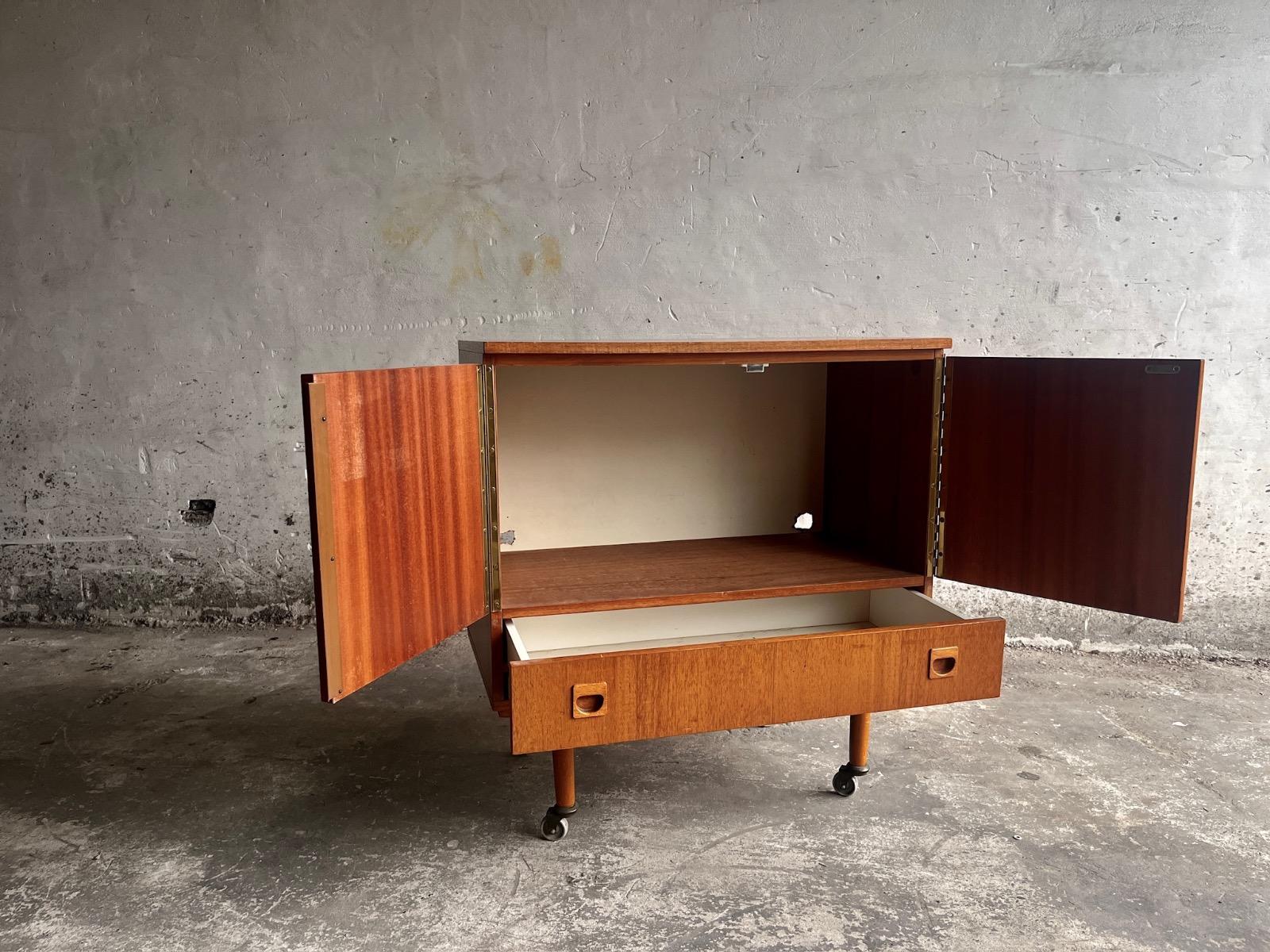 Vintage teakwood dressoir on wheels designed by Berner Huwel