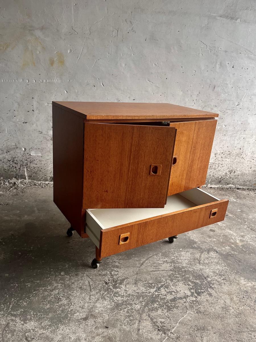 Vintage teakwood dressoir on wheels designed by Berner Huwel